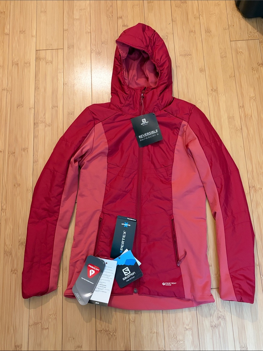 Salomon Reversible Hooded Puffer Jacket in Deep Red and Pink